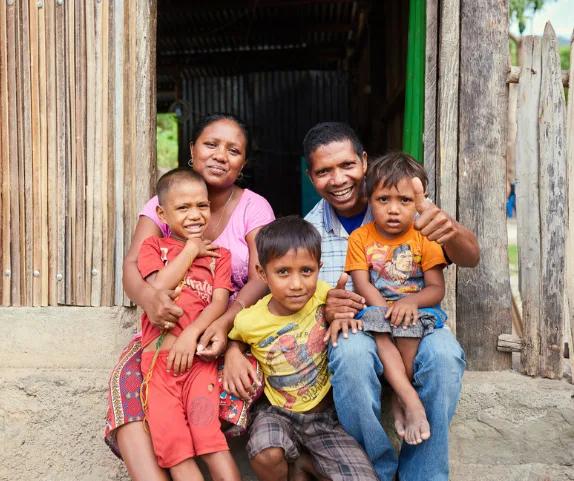 Likisa, Timor-Leste: Ilda and her husband, Angelino, with their children. Ilda was always a saver, even before joining the ROMANSA savings group. She is currently a leader in her group. Photo: Patrick Moran/Oxfam. Oxfam acknowledges the support of the Australian Government through the Australian NGO Cooperation Program (ANCP).