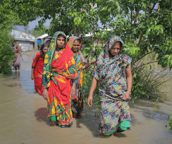 Villagers crossing flood Photo Credit Fabeha Monir