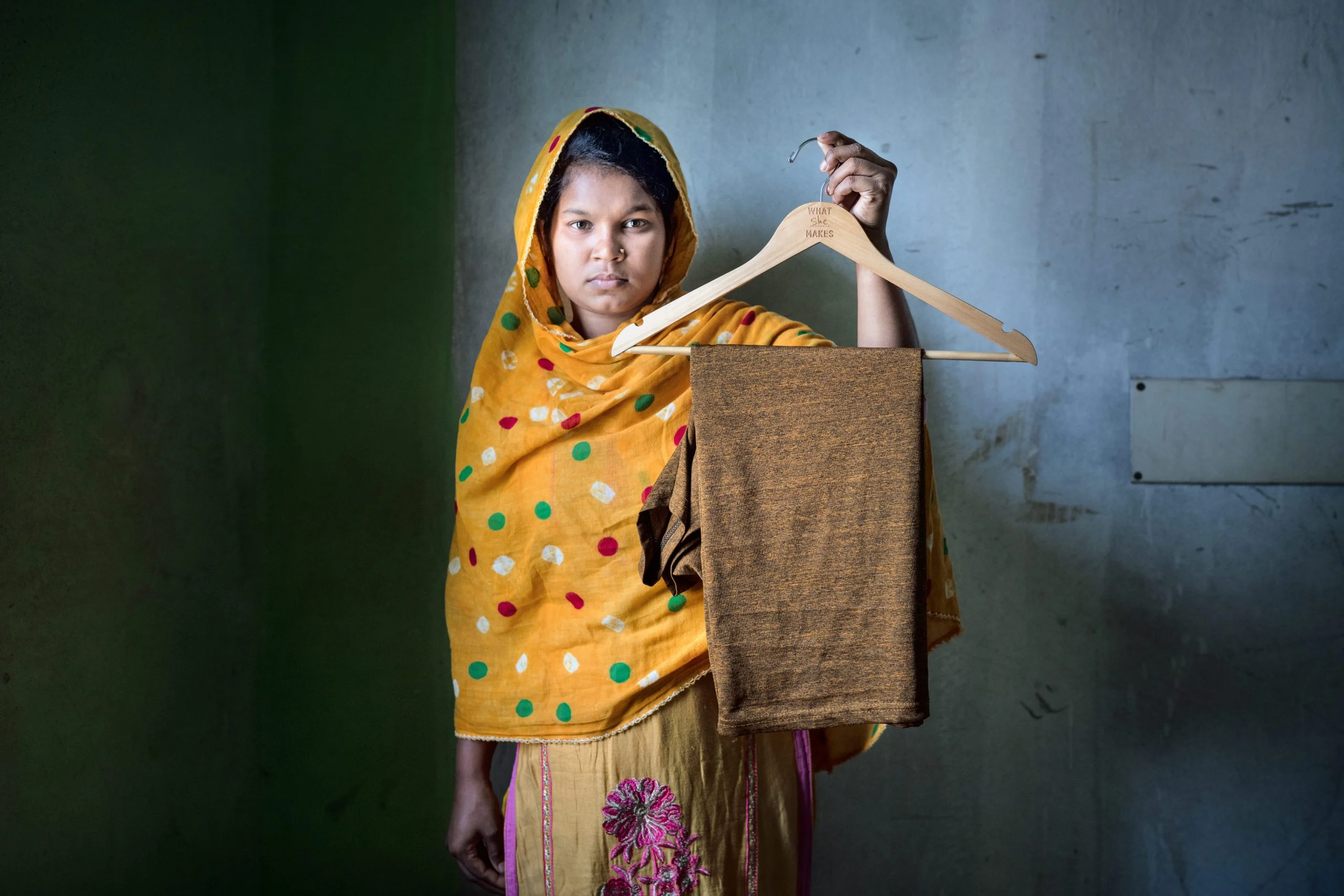 Bangladesh: Rumi Akter is working as garment workers for three years now. Her target is 1440 pieces in 8 hours. With overtime she gets 10000 taka which is not enough for her living in Asulia. Photo: Fabeha Monir/Oxfam