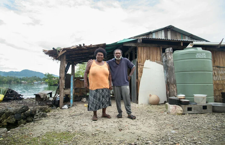 Loreto Island, Malaita Province, Solomon Islands: Judith Harry and her husband Michael Harry pose at their home on Loreto Island. The island is under threat from rising sea levels. Photo: Collin Leafasia/Oxfam Loreto Island, Malaita Province, Solomon Islands: Judith Harry and her husband Michael Harry pose at their home on Loreto Island. The island is under threat from rising sea levels. Photo: Collin Leafasia/Oxfam