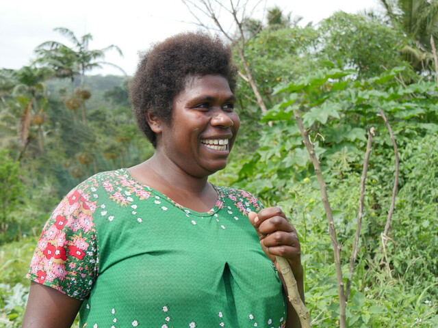 Nelly is a rural farmer on Tanna Island, Vanuatu. Through attending workshops facilitated by Oxfam and local partner Farm Support Association Nelly has learnt climate adaptation techniques which have increased her crop yield. Credit: Rachel Schaevitz/Oxfam