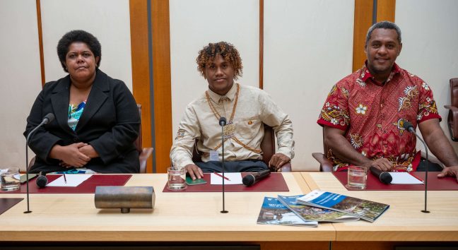 Lavenia, Zedi and Usaia (L-R) address parliamentarians at an event in the Parliament house. Photo: Oxfam Aus.