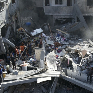 Gaza, Palestinian Territory Occupied: Firefighters, defence personnel, medics and community members clearing the debris of a house in Gaza City. Photo: Marwan Sawwaf/ Alef Multimedia/Oxfam