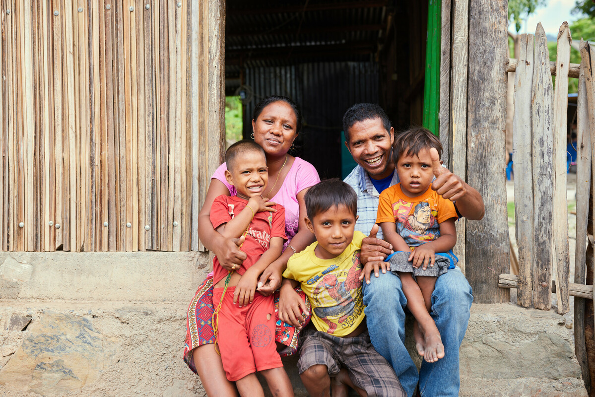 Timor-Leste: Ilda and her husband Angelino, with their kids Rivaldo and Govino. She has always been a saver, even before joining ROMANSA. She is currently a leader in her group. Photo: Patrick Moran/Oxfam