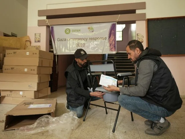Gaza, Palestinian Territory, Occupied: Oxfam staff and partner members deliver folding commodes to shelters in Rafah and Khan Younis. Photo: Alef Multimedia/Oxfam