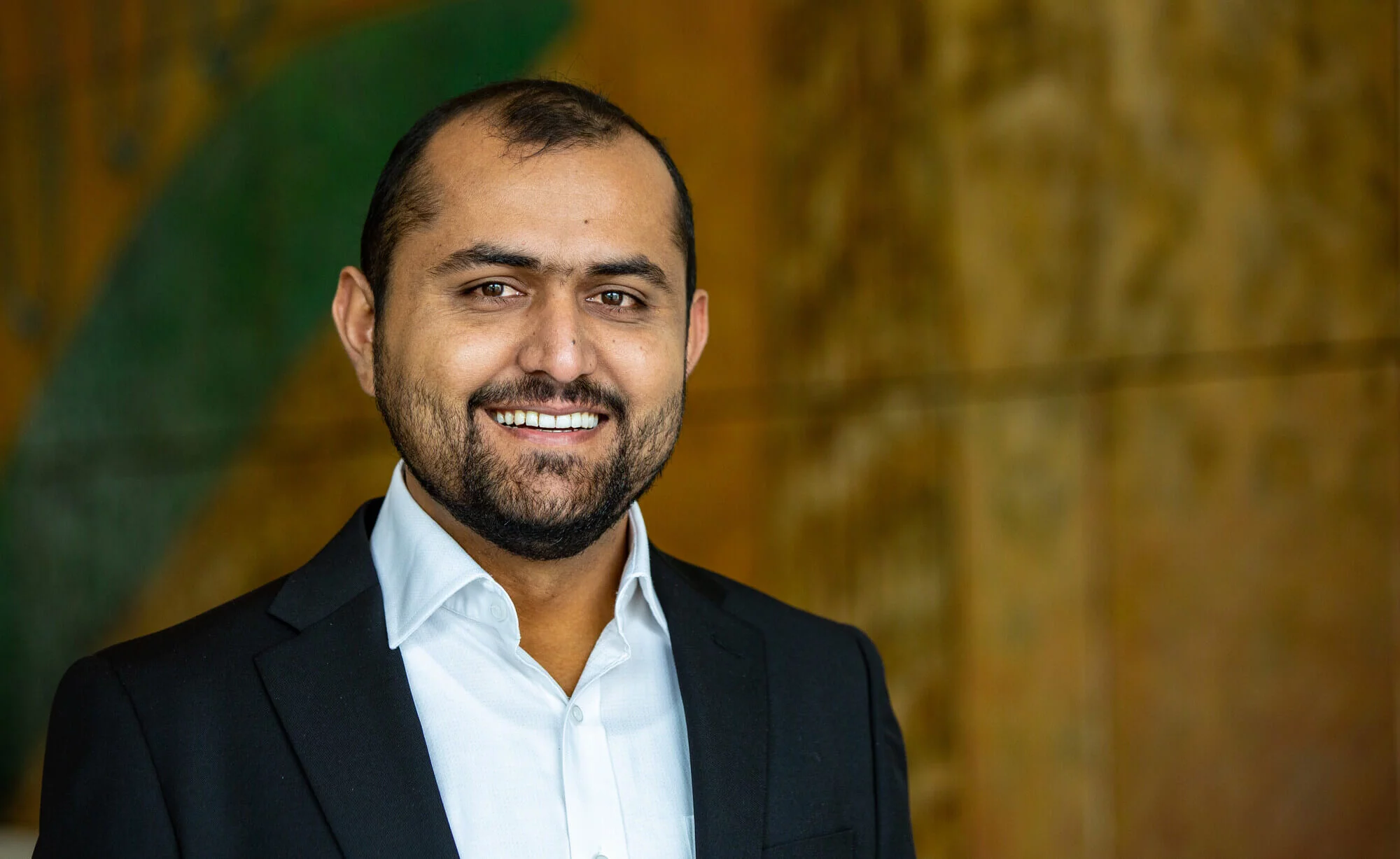 Fazal Ullah smiles at the camera. Fazal Ullah pictured at Parliament House during the 2022 Straight Talk National Summit.