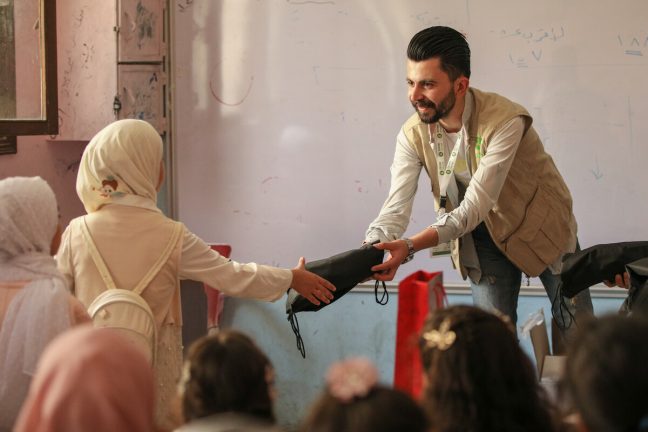 Syria: An Oxfam staff member delivers hygiene materials to female students in Aleppo schools to help them follow and maintain good hygiene practices. Photo: Islam Mardini/ Oxfam