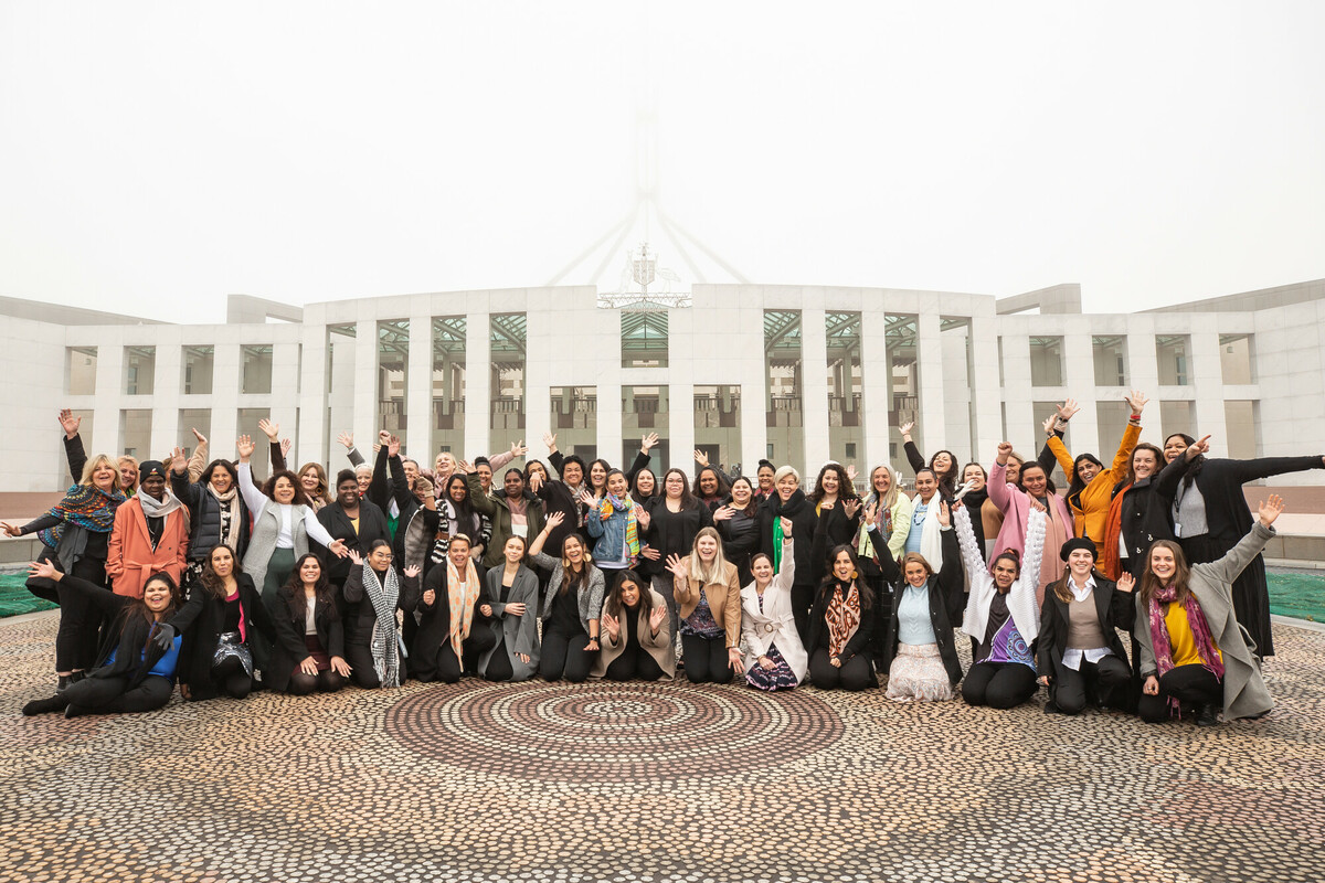 Canberra, Australia: Canberra, Australia: Straight Talk delegates and facilitators pictured in front of the Australian Parliament House the during the 2022 Straight Talk National Summit. Jillian Mundy/Oxfam