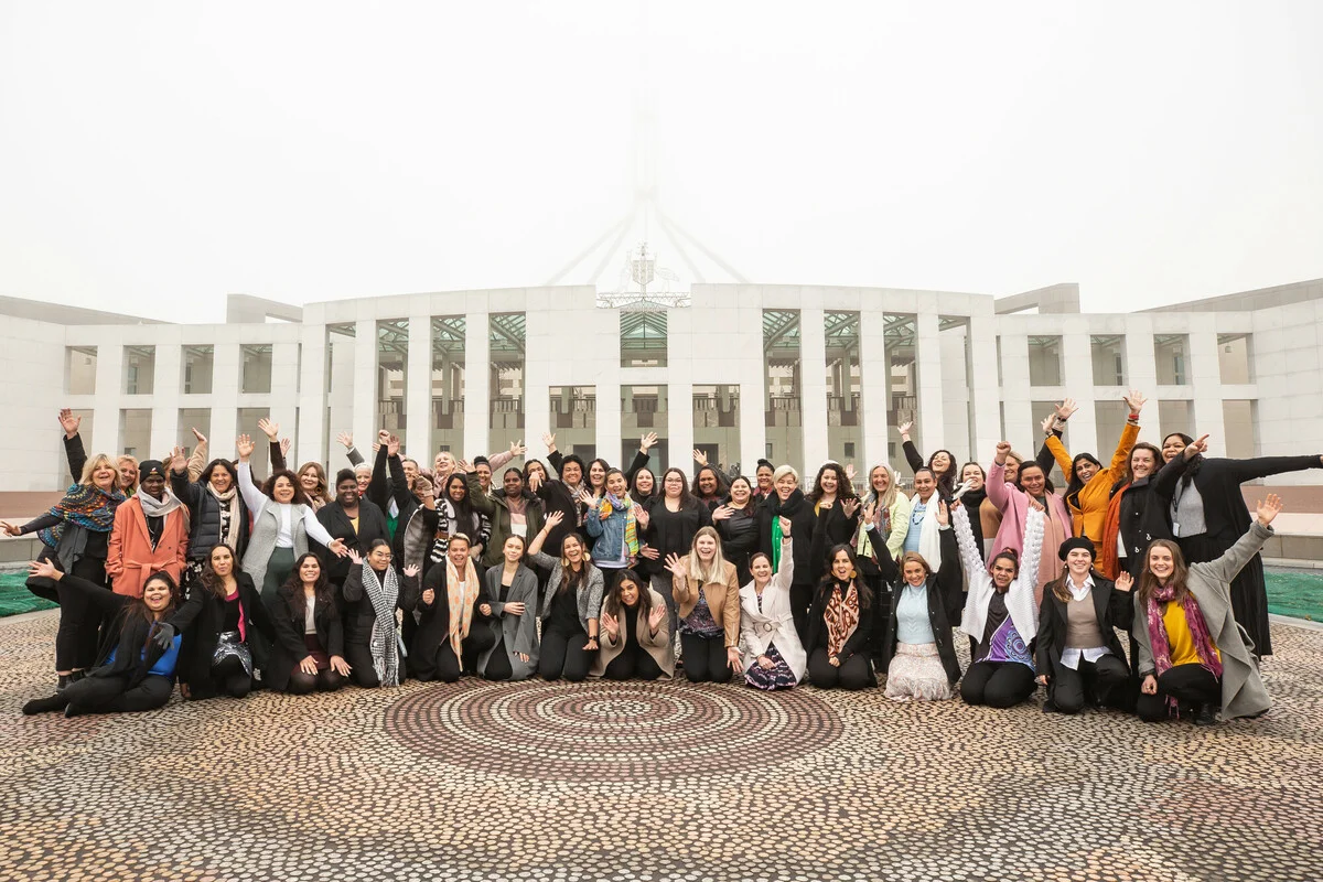 Canberra, Australia: Canberra, Australia: Straight Talk delegates and facilitators pictured in front of the Australian Parliament House the during the 2022 Straight Talk National Summit. Jillian Mundy/Oxfam