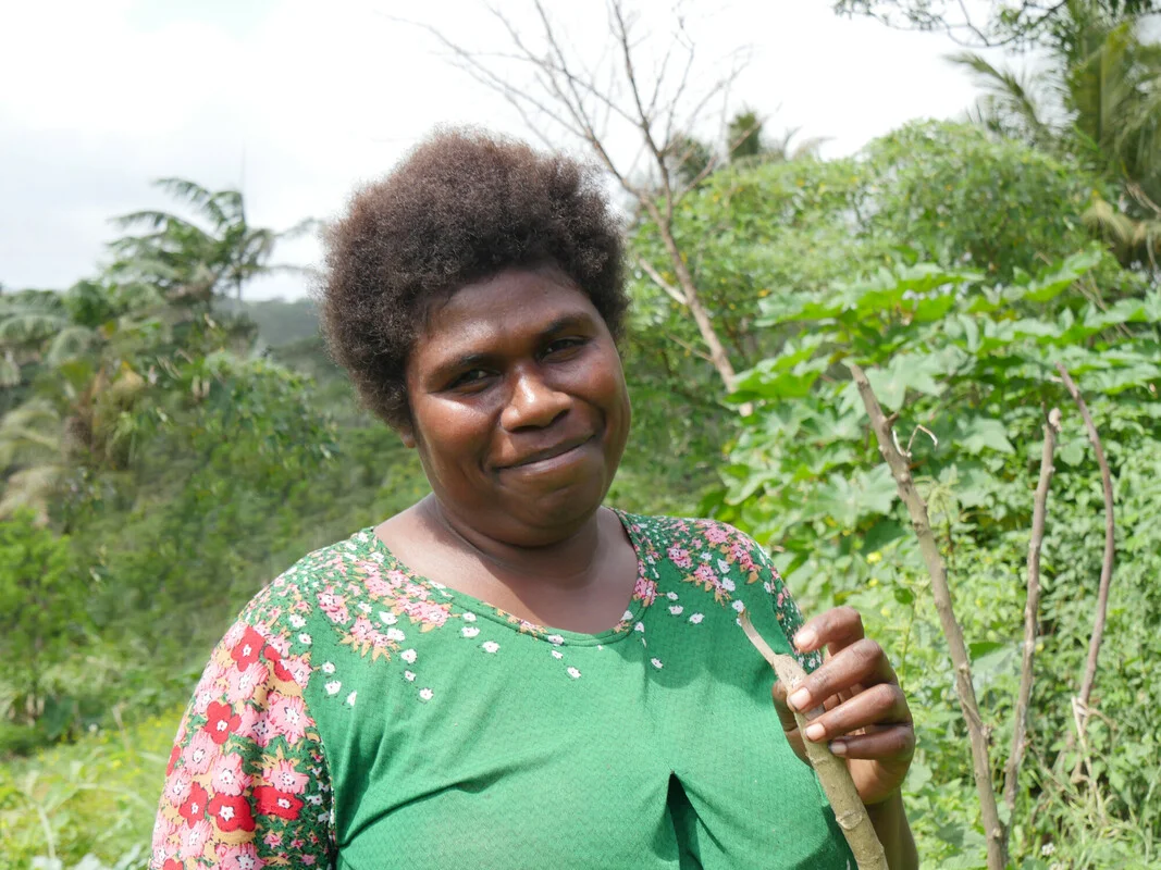 Vanuatu: Nelly Nowa (30), a farmer in rural Lapmuman village on Tanna Island, Vanuatu, stands in her garden. She has participated in workshops run by Oxfam partner, Farm Support Association, and learned climate adaptation techniques to increase her yield. Photo: Rachel Schaevitz/Oxfam Vanuatu: Nelly Nowa (30), a farmer in rural Lapmuman village on Tanna Island, Vanuatu, stands in her garden. She has participated in workshops run by Oxfam partner, Farm Support Association, and learned climate adaptation techniques to increase her yield. Photo: Rachel Schaevitz/Oxfam