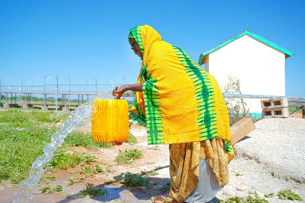 Somalia: Deka Adan, one of the program participant getting water from a water point that was newly built by Oxfam under GFFO project in Faramara village. Photo: Ahmed Osman/Oxfam