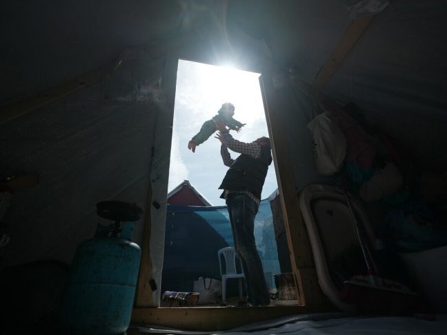 Gaza, Palestinian Territory, Occupied: Fedaa plays with his 3-year-daughter in the middle of his tent in Rafah which he took refuge after losing his house and factory. Photo: Alef Multimedia/Oxfam
