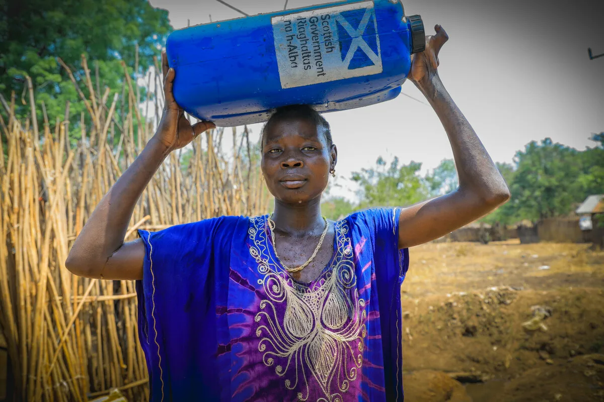 Adugk, 35, fled the conflict in South Sudan to find refuge in Gambella. With the help of Oxfam, she is able to easily access and collect water. Photo: Liban Hailu/ Oxfam Adugk, 35, fled the conflict in South Sudan to find refuge in Gambella. With the help of Oxfam, she is able to easily access and collect water. Photo: Liban Hailu/ Oxfam
