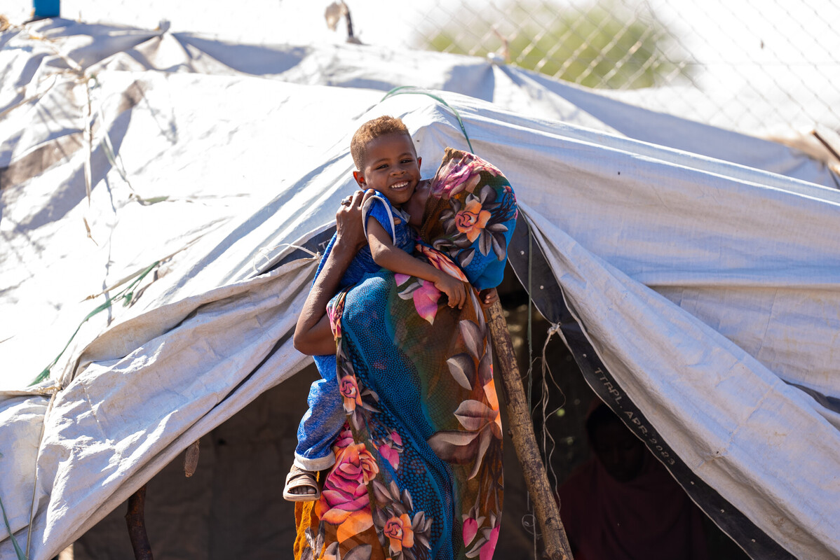South Sudan: Suad with her nephew at their home in Renk, South Sudan. They are among nearly a million people displaced by the ongoing conflict in Sudan. Photo: Herison Philip Osfaldo/Oxfam