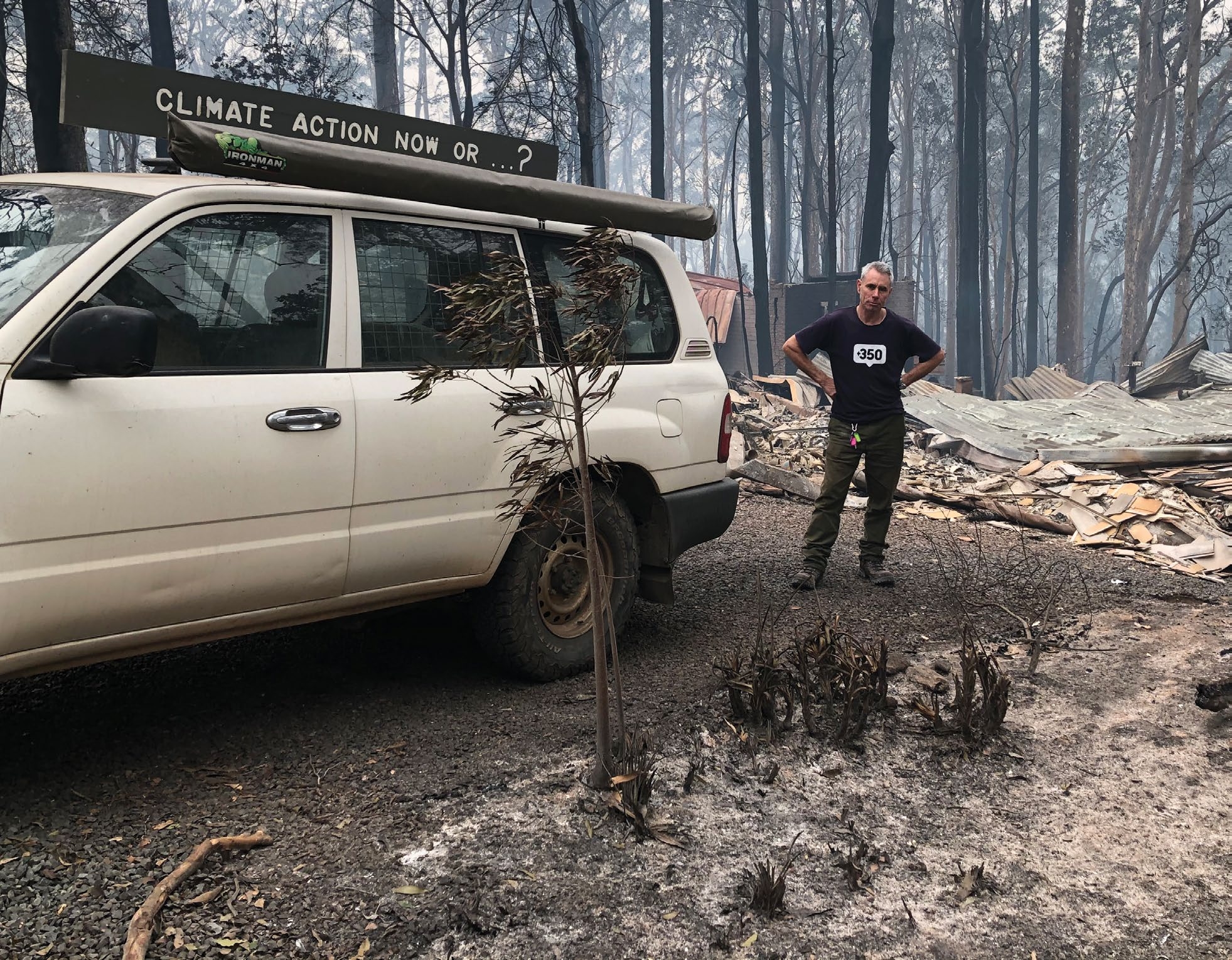 Jack Egan stands in front of his burnt-down home in Rosedale, NSW on New Year's Day in 2020. Photo: Cath Bowdler