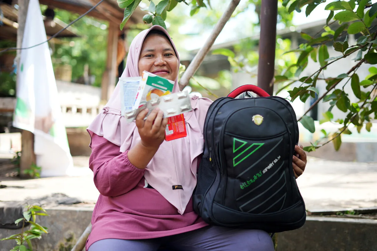 Lombok, Indonesia: Husaini's community experiences frequent flash floods and earthquakes. She received resources from Oxfam local partner, KONSEPSI, for an emergency bag in preparation for disasters. Photo: Aimee Han/Oxfam