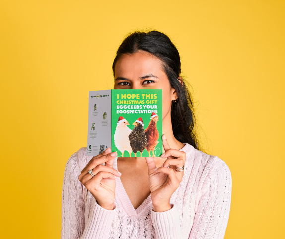 Australia: Safia holds up an Oxfam Unwrapped Christmas Chicken card. Photo: Michelle Jarni