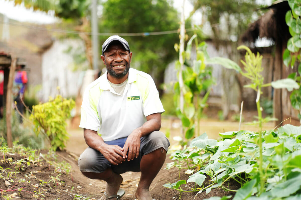 Papua New Guinea: The installation of three water taps in Somano's hamlet has allowed him to grow an abundant garden. The garden harvest contributes to feeding his family, fellow hamlet members, and gaining some household income through sales at the local market. Photo: Aimee Han/Oxfam